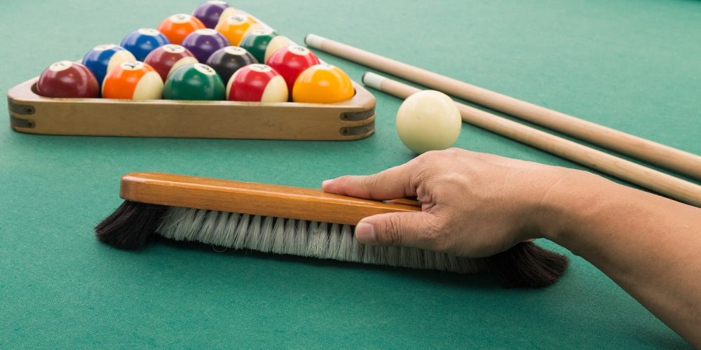 hand-brushing-snooker-pool-billards-table-with-bal-2021-08-30-18-49-45-utc-min.jpg